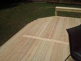Instead Of Having Unsightly Alternating Seams For Decks Larger Than Traditional Lumber Lengths Here We Had A Woo Building A Deck Wood Deck Deck Building Cost