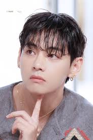 Taehyung was wearing his iconic hazel lenses