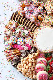 Everyone loves brownies, and these scrumptious treats deliver the full handheld cake experience, complete with creamy chocolate frosting. Birthday Dessert Board The Bakermama