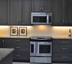 You can spice up the brown kitchen colors by using different accessories that have different colors. Grey Stained Hickory Cabinets Grey Kitchen Https Www Facebook Com Finedesignbyamber Stained Kitchen Cabinets Gray Stained Kitchen Cabinets Staining Cabinets