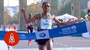 He is a world record holder in the 100 metres, 200 metres and 4 × 100 metres relay. What It Takes To Be The World S Fastest Marathon Runner Youtube