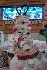 Rustic Birch Tree Wedding Cake Rustic Birch Tree Bark Cake Decorated With One Large Sugar Magnolia And Several Smaller Sugar Carn Fancy Wedding Cakes Magnolia Wedding Wedding Cakes