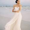 A simple beachy wedding dress does not mean boring, it means understated elegance and allows the setting to shine as well as the bride. 1