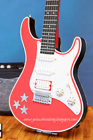 I made the guitar entirely in fondant (except for the guitar strings that were made using thread). Stand Up Electric Guitar Cake Jessica Harris Cake Design