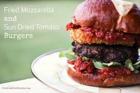 These crispy fried mozzarella slices make an unusual and tasty starter. Fried Mozzarella And Sun Dried Tomato Burgers