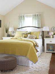 In this bedroom, a screen covered with patterned wallpaper functions as a headboard and as a springboard for the room's color scheme. Decorating Ideas For Yellow Bedrooms Better Homes Gardens