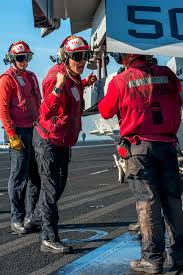 This article is a stub. U S Navy Petty Officer 2nd Class Cody Askew Center Shouts Instructions To U S Navy Petty Officer