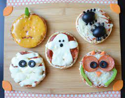 Easy Halloween Mini Pizzas Cbc Parents Halloween Pizza Fun Halloween Treats Halloween Food Crafts