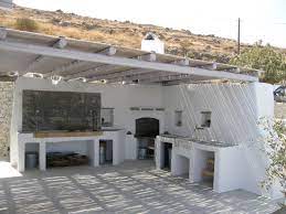 open air kitchen with bbq spot oven and marble sink concrete counters covered by cement mortar paros gr cuisine exterieure idees de patio cuisine exterieur