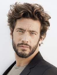 The curls on top with shorter sides have gained much fan base while talking of the trending names in men's hairstyles. Beard Styles For Men With Curly Hair Medium Hair Styles Wavy Hair Men Long Hair Styles Men