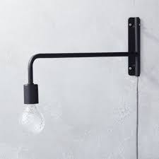The embellishment of some golden elements increase some classic to the modern style. Swing Arm Black Wall Sconce Reviews Cb2