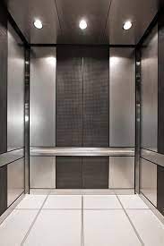 Levele 101 Elevator Interior With Customized Panel Layout Panels In Stainless Steel With Sandst Elevator Interior Lobby Interior Design Modern Interior Design