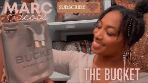 MARC JACOBS 'THE LEATHER BUCKET BAG' DRAGON FIRE UNBOXING + WHAT FITS  INSIDE