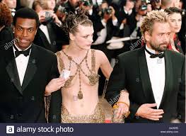 The fifth element (luc besson, 1997). L R Chris Tucker Milla Jovovich And Director Luc Besson Arrive For The Premiere Of The Fifth Element At The 50th Cannes Film Festival Stock Photo Alamy