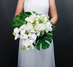 Tropical Wedding Bouquet With White Orchids And Greenery Large Monstera Leaves Realist White Bridal Bouquet Tropical Wedding Bouquets Tropical Bridal Bouquet