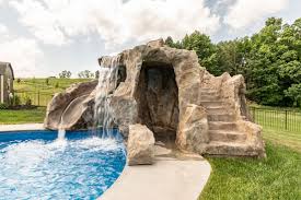 Backyard pools with slides and waterfalls. Poolside Water Features Rock Water Slides Waterfalls Grottos Oasis Outdoor Living