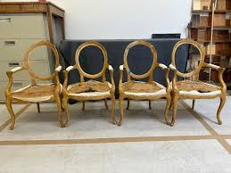 Before and after These four maple chairs were quite a mess. All the backs  were loose, the faux finish was flaking off everywhere, and a bad doggie  had chewed