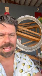 Need your tiki opinion. I have this Huge metal ring piece i want to involve  in my tiki hangar bar. Looks like huge porthole. But the opening is 74” so  a tv for video is out. Thinking of creating a ...