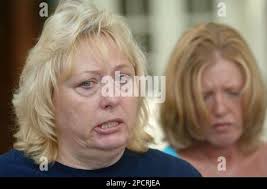 Pam Campbell, left, of Buckhannon, W.Va., sister-in-law of deceased Sago  miner Marty Bennett speaks about the deaths of 12 miners who died in an  explosion