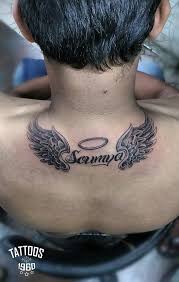 They can be worn anywhere on the body angel wing tattoos can be worn anywhere on the body, both alone and accompanying another to show off an angel and devil attitude. Angel Wings With A Name And A Holy Ring Tattoos Name Tattoos Tattoos For Guys