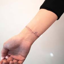 Noch ein beispiel für paar tattoos. 11 Bracelet Tattoo Ideas To Replace Jewelry Bracelet Ideas Jewelry Multipleinitialtatto Schmucktattoo Tattoo Armband Handgelenk Armband Tattoo