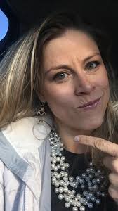 Is smiling frowned upon in passport photos?