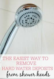 The Easiest Way To Remove Hard Water Deposits From Shower Heads Cleaning Shower Head Hard Water Stain Remover Shower Heads