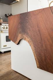 You Really Need To See The Raw Edge Wood Waterfall Counter In This Home Hunker Waterfall Countertop Waterfall Counter Live Edge Countertop