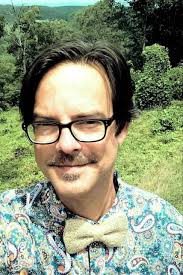 Cooper hired to teach English