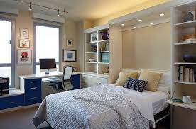 The look works best with a desk that is long but not deep—perfect for a wall space work area. 25 Versatile Home Offices That Double As Gorgeous Guest Rooms Home Office Guest Room Guest Room Office Guest Bedroom Office