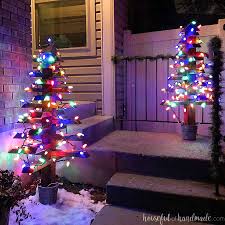 Just put some christmas lights in jars and then hang them in a cluster. Diy Outdoor Christmas Trees With Lights Houseful Of Handmade