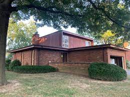 The original brick was painted a cool blue at this mcm estate. A St Louis Vintage Store Owner Transforms Her Own Mid Century Modern House Architectural Digest