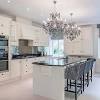 Floor tiles remain a good option for kitchens because they come in a wide range of colors and materials. 1