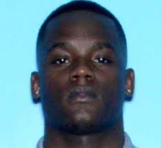 Man charged in deadly Birmingham shootout surrenders at jail