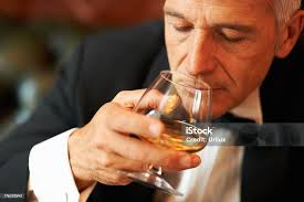 Wealthy Man Drinking Brandy Stock Photo