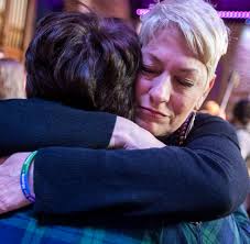 Women raising LGBTQ kids gather in solidarity to offer 'free mom hugs'