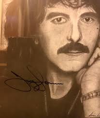 Also a fan-club thing I did recieve a few years back.A signed drawing of  Tony Iommi…not sure of The artist!May not the best piece of art,but an  obvious place at the Wall