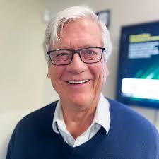 About Dr. Charles Heuser