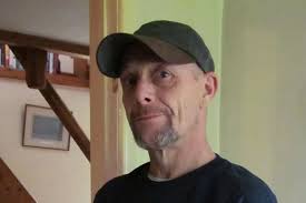 Hungry man tries to separate frozen burgers