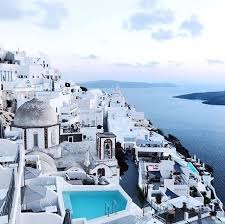 Multi Colored Cliffs And Whitewashed Buildings Set The Scene In Santorini A Greek Island In The Aegean Sea Photo Courtesy Of S Greek Islands Santorini Island