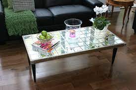 Magazine table from the beyond the glasses with its hand illumination i decided to make. Diy Mirrored Coffee Table Julie Loves Home