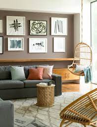 Large living room featuring gray walls and a gray couch, along with a large area rug and a fireplace. 20 Living Room Wall Color Ideas Magzhouse