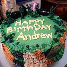 Starting from the bottom of the cake, pipe icing around the edge, trying to keep even pressure on the bag so that the layer of icing is even. Simple Army Birthday Cake Army Cake Cake Army Birthday Cakes