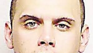 Suspect charged in year-old Domino's armed robbery