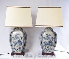 The lovely glaze has been applied by hand for a nuanced, layered look that complements and enhances the textures of the lamp. Pair Blue White Porcelain Table Lamps Chinese Lighting