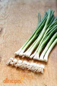 Chop off the end of the scallions. How To Regrow Green Onions From Scraps Regrow Green Onions Regrow Vegetables Growing Vegetables