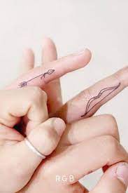 17 Top Amazing Ideas For Finger Tattoos Deliciousa Matching Finger Arrow And Bow Tattoos Finger Tattoos Matching Tattoos Arrow Tattoo Finger