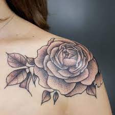 Tattoo on back of girl's right shoulder this tattoo is designed to have the appearance of an actual rose. Rose Tattoo On The Left Shoulder