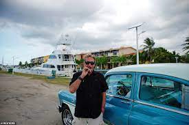 Us millionaire john mcafee on his yacht anchored at the marina hemingway in havana, in june 2019. Qtw6xrs2qjjr M