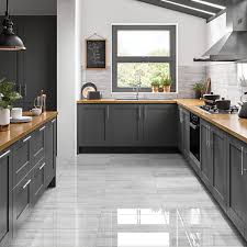 A stone effect tile is a brilliant compromise for those who want a maintenance free kitchen floor but still love the look of a natural stone. Wickes Olympia Light Grey Polished Stone Porcelain Wall Floor Tile 600 X 300mm Wickes Co Uk